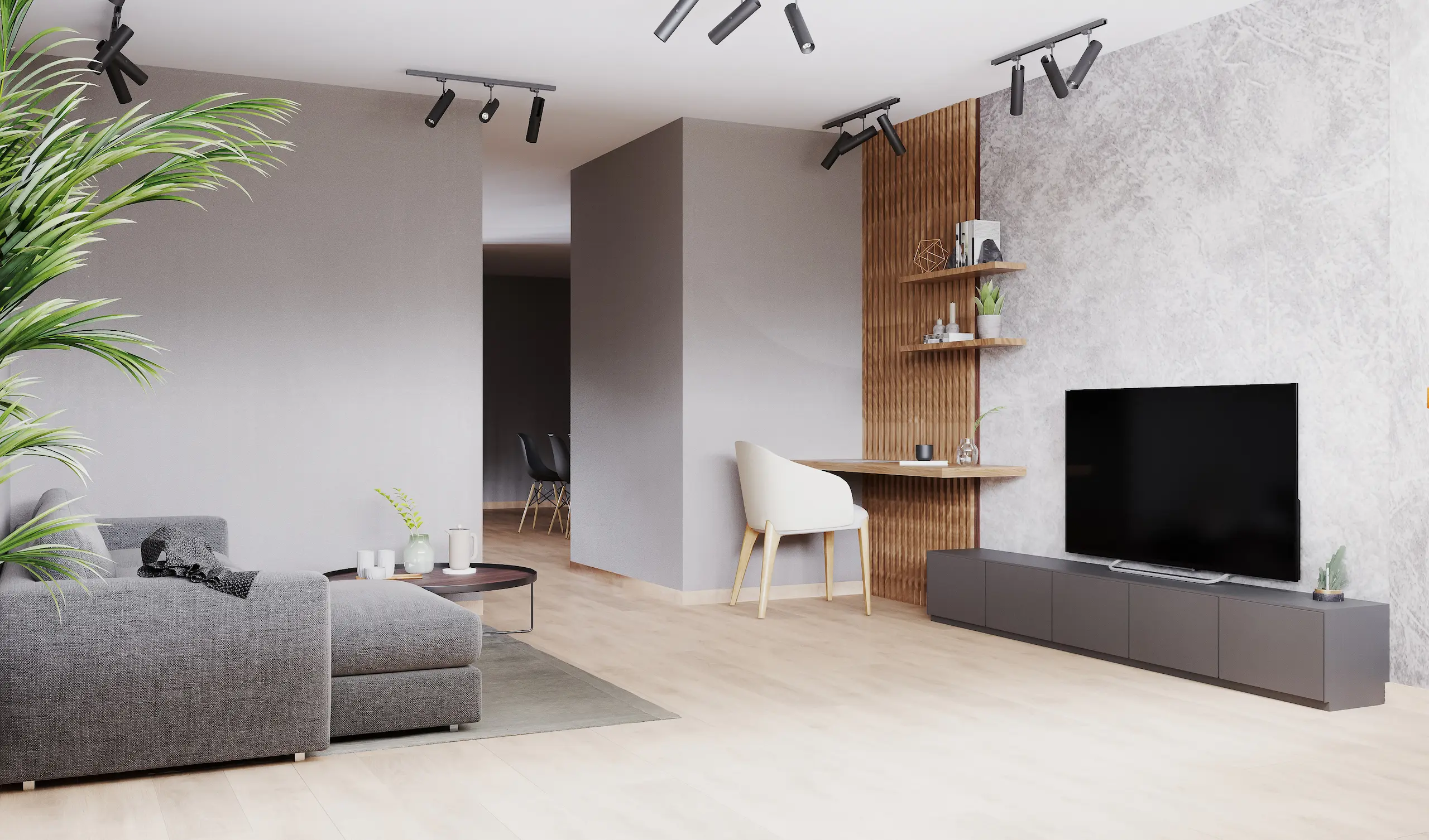 Salon moderne avec canapé gris et télévision.